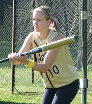 Image: Bunting practice — Courtney Westbrook takes a few practice bunts before taking the field against Waco Reicher.
