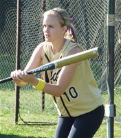 Image: Bunting practice — Courtney Westbrook takes a few practice bunts before taking the field against Waco Reicher.