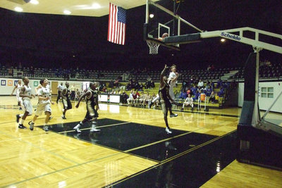 Image: Avoiding The Defender — Italy finishes strong on the fast break and ultimately finishes the game strong beating the mildred Eagles 59-56 in overtime.