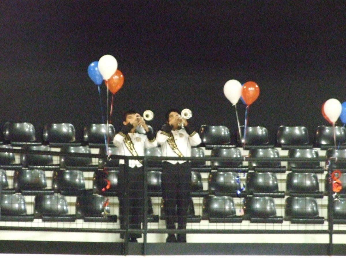 Image: “Day is done” — Collier and Michael play the lonely melody of “Taps”.