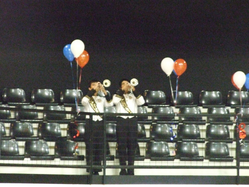 Image: “Day is done” — Collier and Michael play the lonely melody of “Taps”.