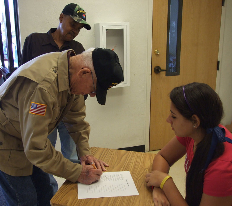 Image: Ward and Copeland — James Ward signs in as Billy Copeland looks on.