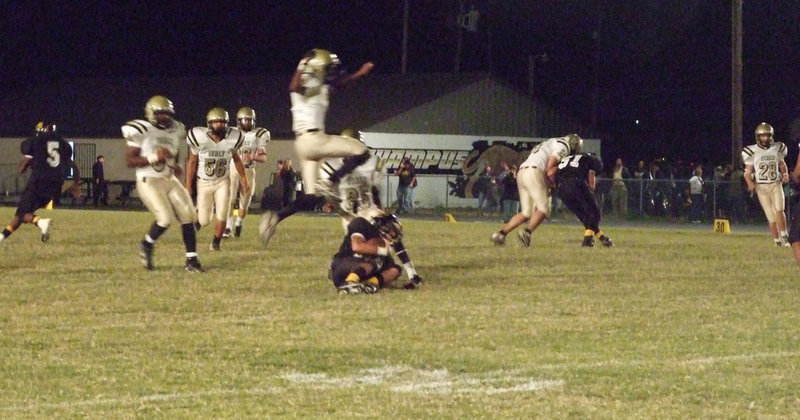 Image: Cat jumping — Italy’s kickoff unit tackles the Itasca runner before he can do any damage.
