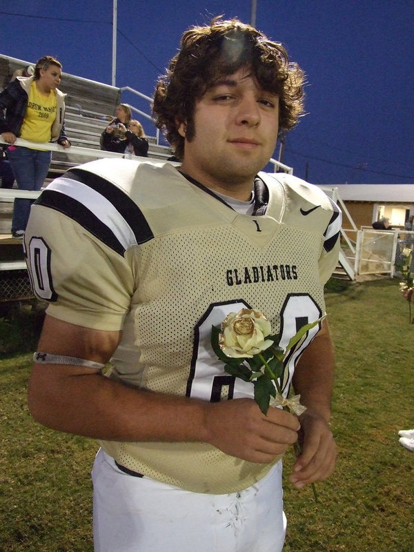 Image: Ivan Roldan — Ivan just before he hands the rose to his mother.