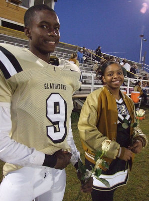 Image: Aaron and Jaleecia — Seniors, Aaron Thomas and Jaleecia Fleming, try to keep smiling on Senior Night.