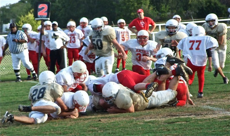 Image: Fumble rumble — The Gladiators and the Longhorns got down and dirty on Thursday.