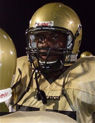 Image: Bars and scars — Larry Mayberry’s helmet gashes are a testament to the damage Italy’s JV team can inflict on their opponents.