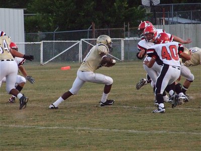 Image: Anderson cuts back — Jasenio Anderson runs a quarterback keeper up the middle.