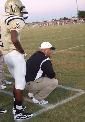 Image: Coach Craig Bales — Heath Clemons has Coach Bales’ back.