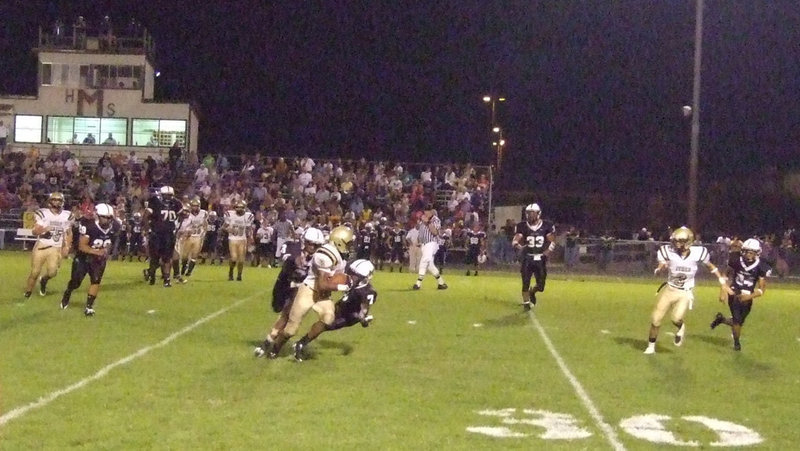 Image: Desmond runs — Desmond Anderson(8) hauls in a pass for big yards against Malakoff.