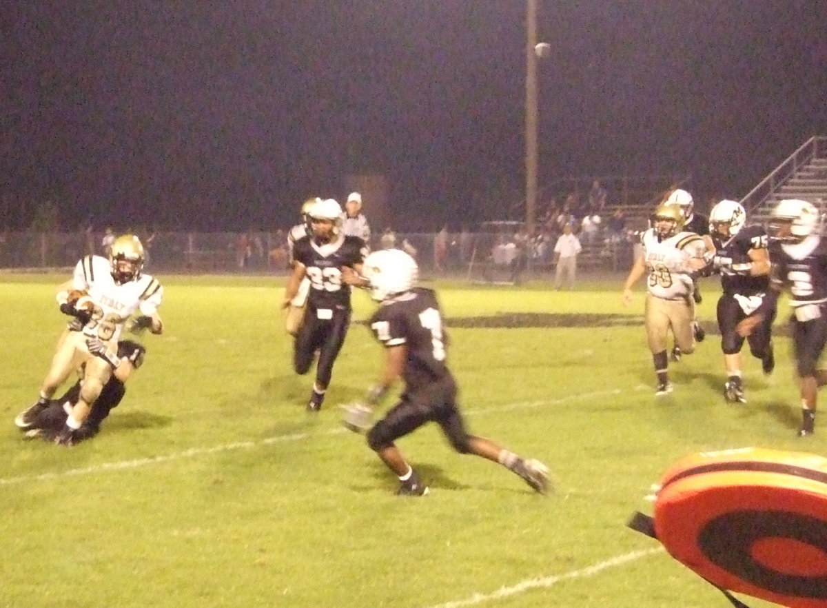 Image: Huck hustles — Italy’s Justin Hayes(36) fights for yards in the rain against the Tigers.
