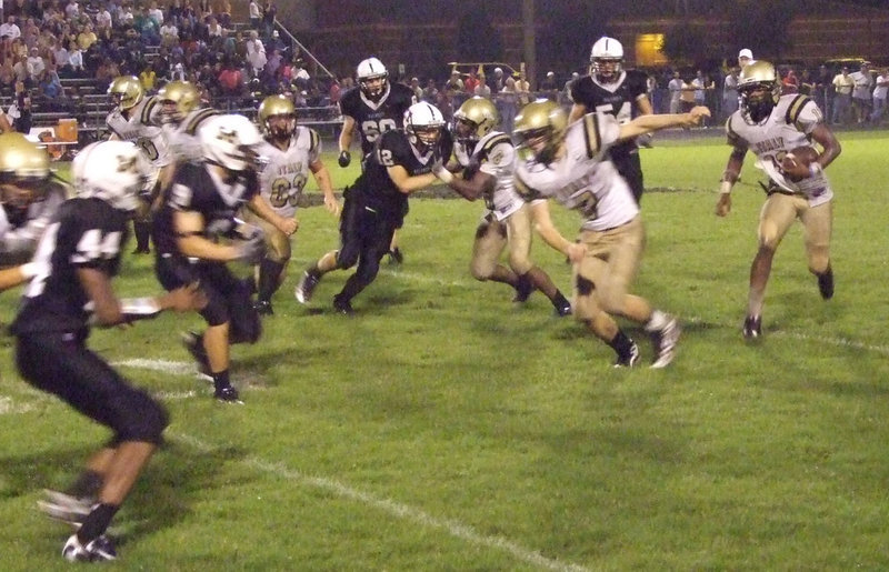Image: Jasenio gains yards — Zachary Hernandez(63), Desmond Anderson(8) and Kyle Wilkins(7) led the way for quarterback Jasenio Anderson who had an incredible performance against Malakoff.