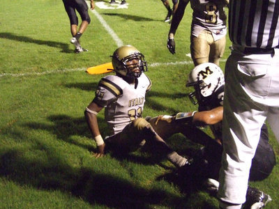 Image: Was Jasenio in? — After stretching for the pylon with no ticks left on the clock, Italy quarterback Jasenio Anderson(11) looks up at the referee for the call. The 2-point conversion was good and the Gladiators tied the game 42-42 forcing an overtime.