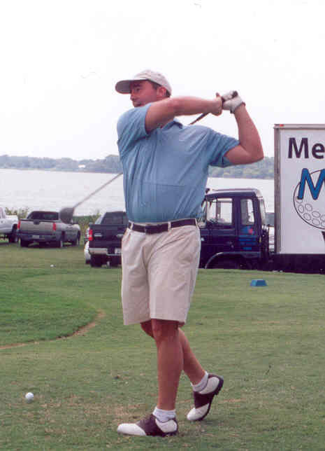 Image: Practice Swing — Tommy Forsythe of Community Bank works on his swing for the upcoming event.