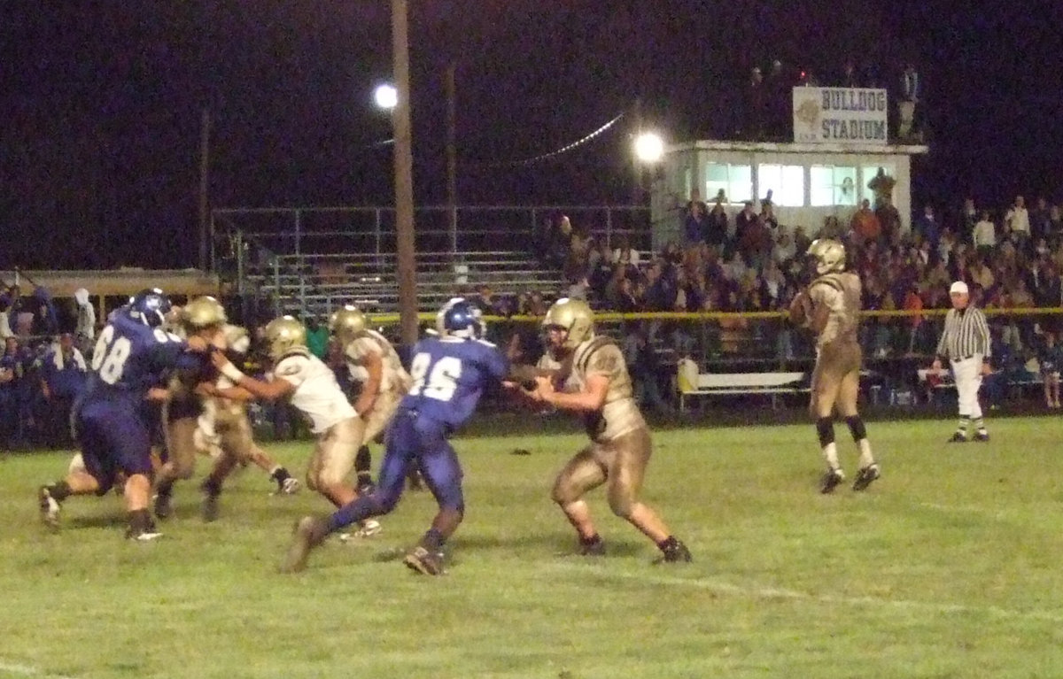 Image: Time to survey — Jasenio Anderson looks to pass against Wortham.