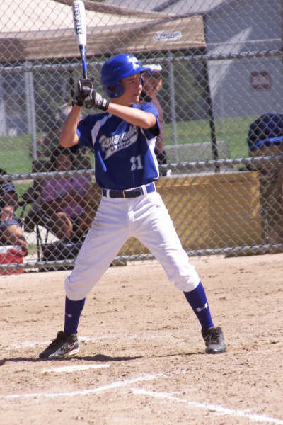 Image: Blake stands strong — Blake Laney, selected by his tournament peers as the tournaments Offensive MVP, shows his form that helped him finish with a .545 batting average along with 3-home runs and 9-RBIs.
