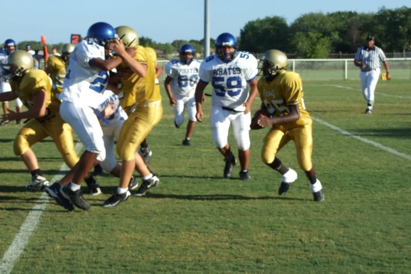 Image: Protecting the ball — Italy Gladiators fight back the Chilton Pirates to protect the ball.