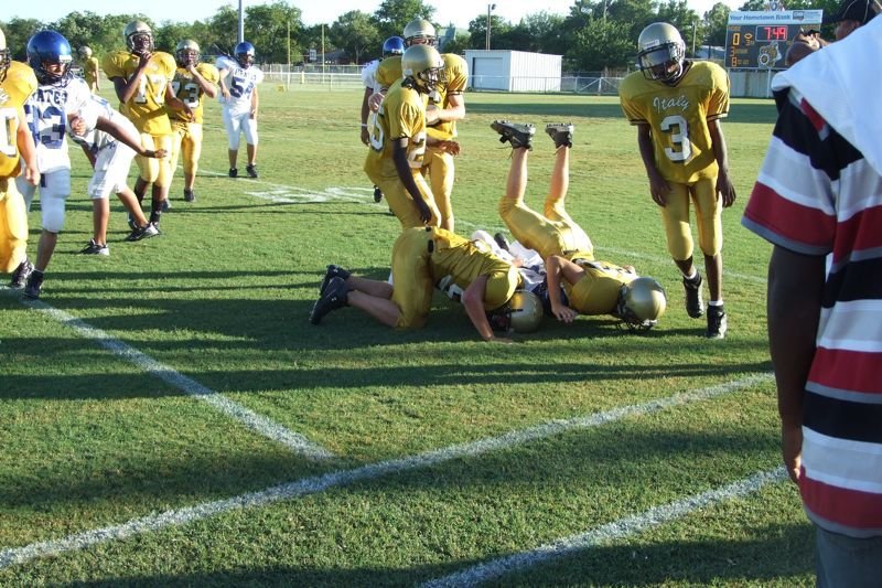 Image: Pirate captured after interception — Gladiators stop Chilton’s return of an intercepted pass at the midfield sidelines.