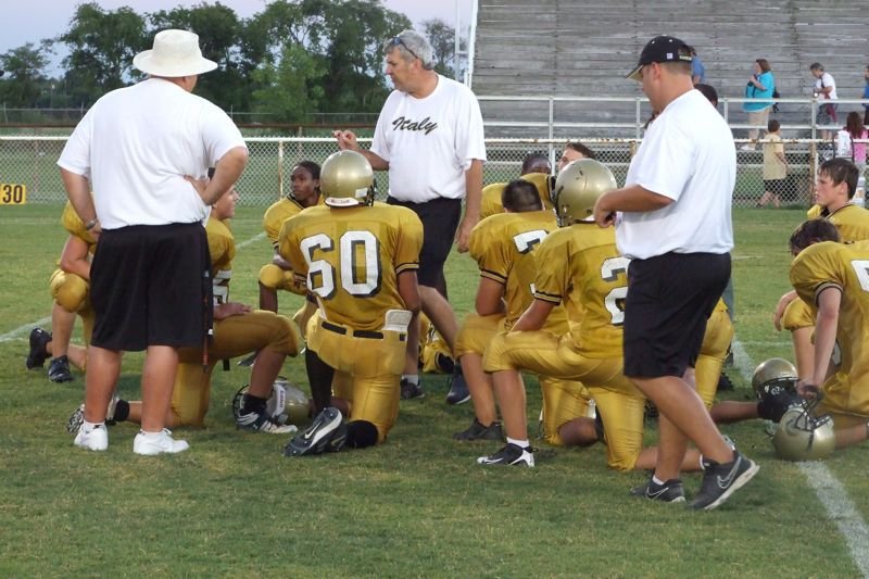Image: Post game review — Coaches and players reflect on the game.