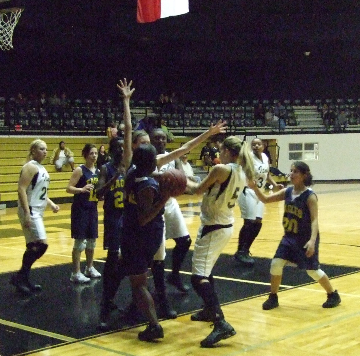 Image: Italy defends — The Lady Gladiators plan another heist as they try to steal the ball from a Lady Eagle on Tuesday night.