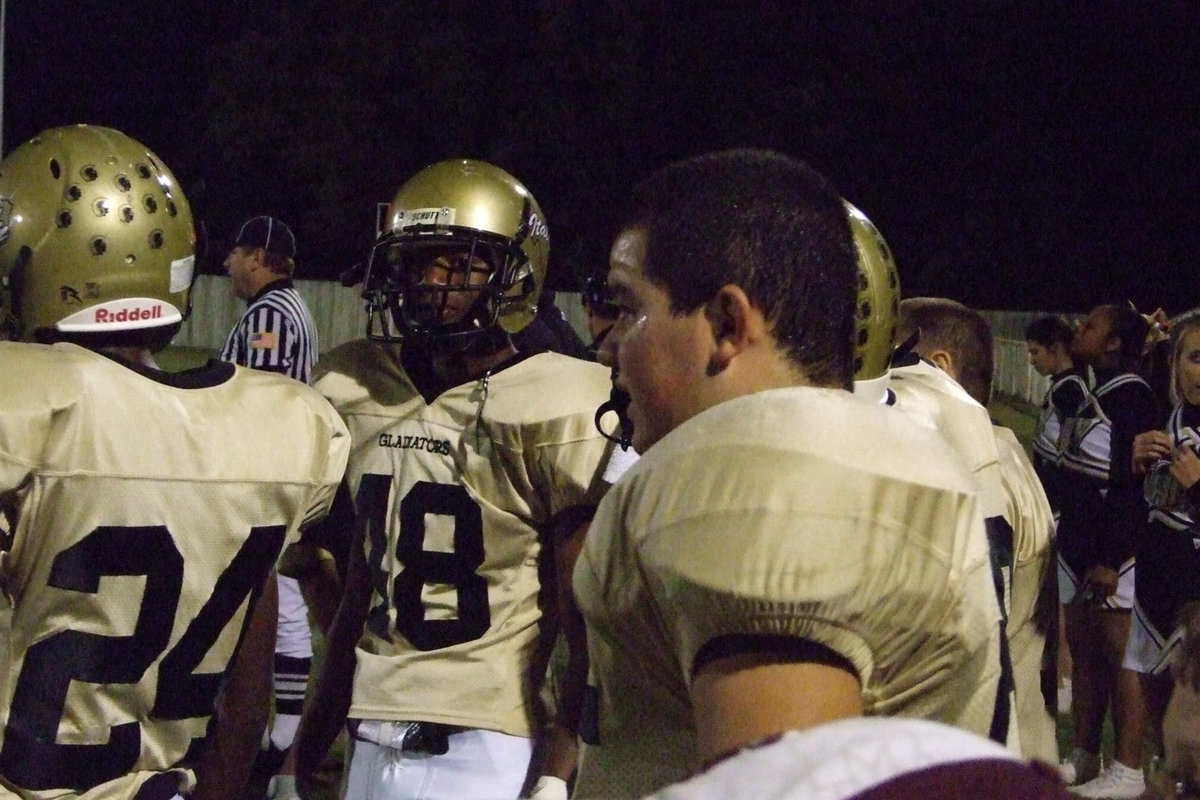 Image: Moore and Enriquez — Darrin Moore and Ross Enriquez watching the game.