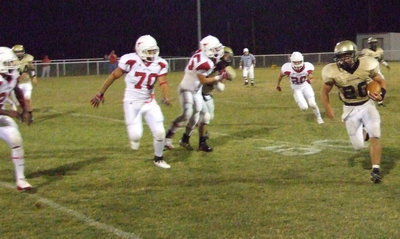 Image: Major run — #20 Clay Major escapes the Longhorn wrath.