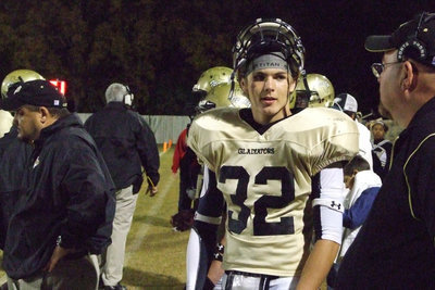 Image: Jonathan Nash — Nash discusses the plays with the coaches.