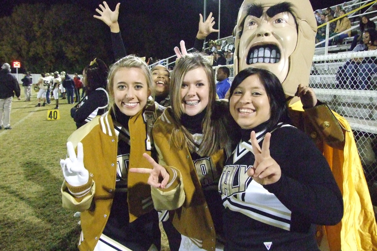 Image: IHS Cheerleaders — Lexie, Destani, Kaitlyn, Blanca and Bianca smile for the camera.