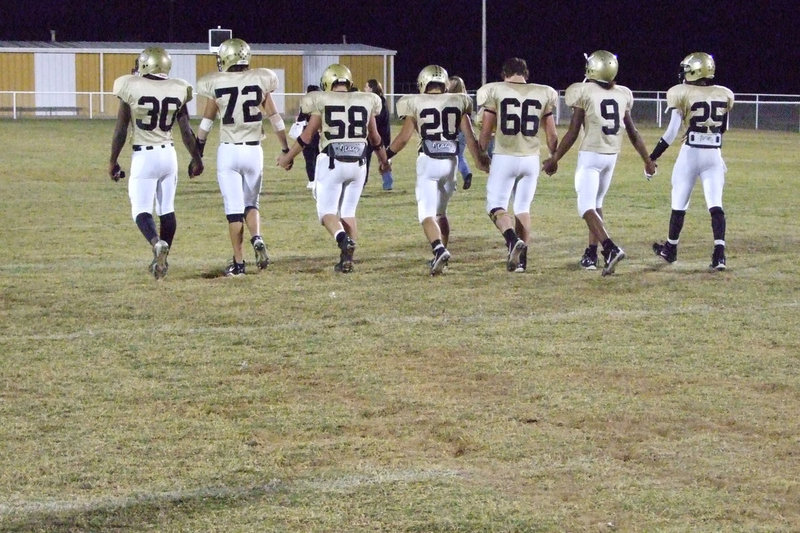 Image: The Last Walk — Seniors walked the field for the last time Friday night.