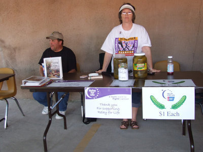 Image: Pickle booth — This booth was selling pickles and cookbooks for Relay for Life. Karen Mathiowetz and her husband Brian.