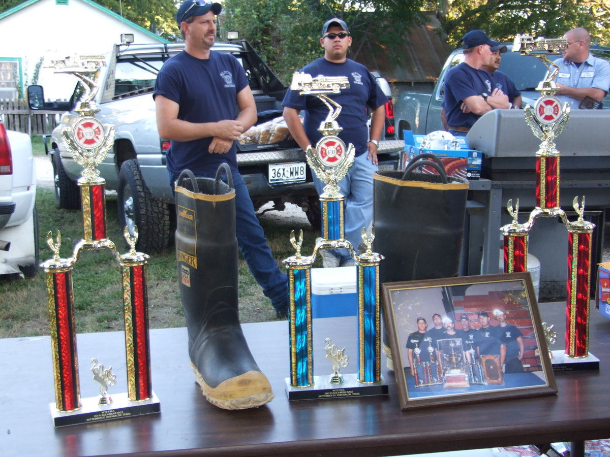 Image: Milford Fire Department members — Milford Firemen, Scott Kelley, Ruben Garza, Andy Frank and Carlos Garza and Italy Fireman Brad Chambers grilling the dogs and burgers.