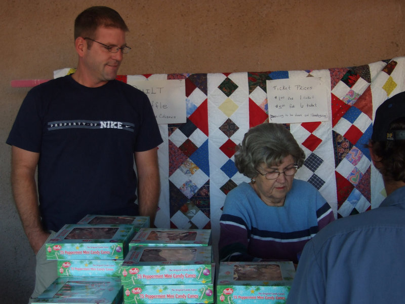 Image: Quilting booth — Milford Senior Citizen’s booth selling raffle tickets for the beautiful quilt.