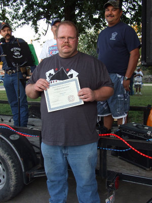 Image: Lance Finch — Lance Finch receiving his certificate for serving 22 years with the Milford Fire Department.