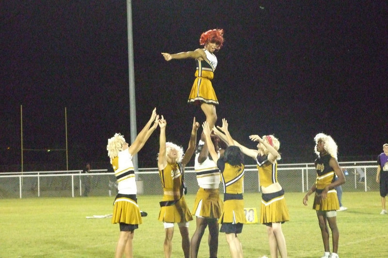 Image: La’Daishia stands tall — How many cheerleaders does it take to lift another? (No answer).