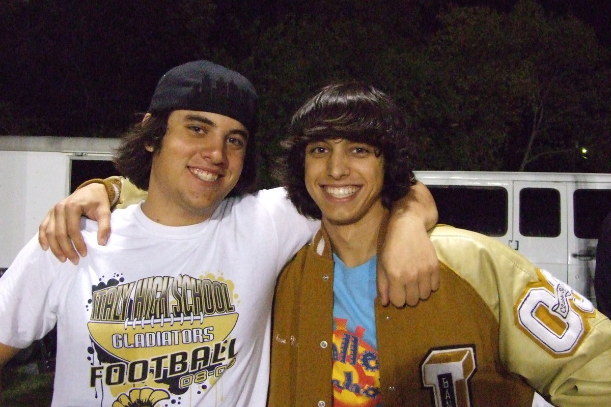 Image: Trevor and Chase — Longtime friends, Trevor Davis and Chase Michaels are a part of the team that takes care of the band.