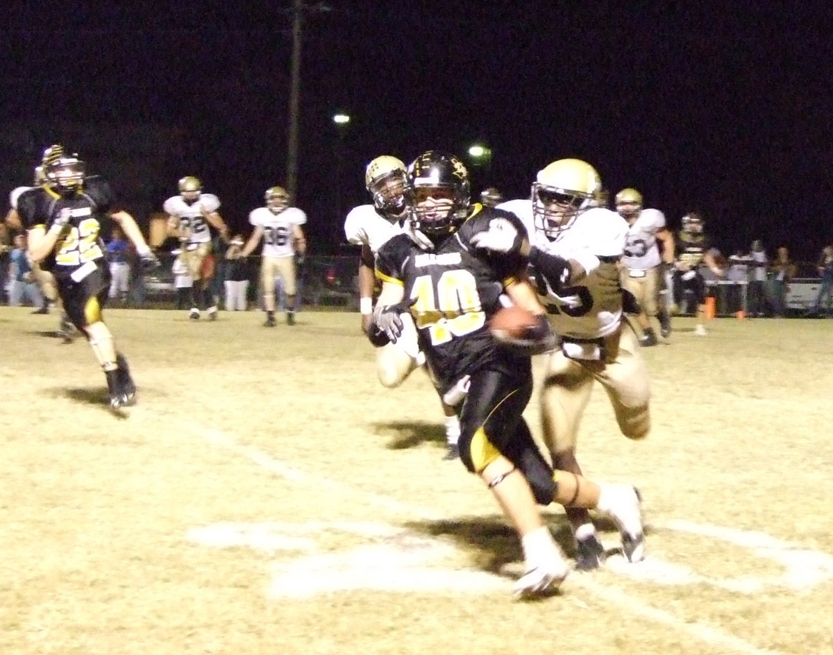 Image: Diamond Rodgers — #25 Diamond Rodgers tries to bring Dawson’s #40 Nick Renfro down.