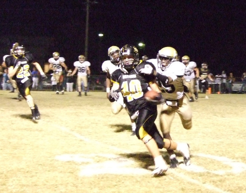 Image: Diamond Rodgers — #25 Diamond Rodgers tries to bring Dawson’s #40 Nick Renfro down.