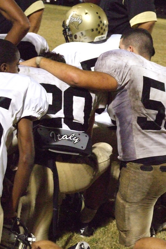 Image: Brotherly love — Ross Enriquez comforts Clay Major after the loss to Dawson.