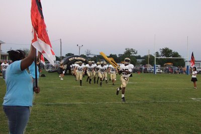 Image: Varsity gets crunk! — #25-Diamond Rodgers leads the Gladiators to battle.