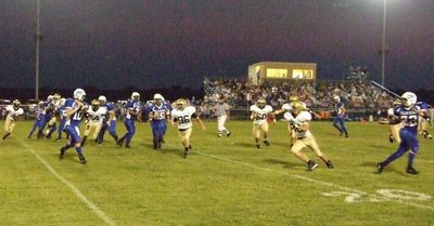 Image: Frost on offense — Frost’s #10-Sam Stroder passes to #22-Ty Ritterbach.