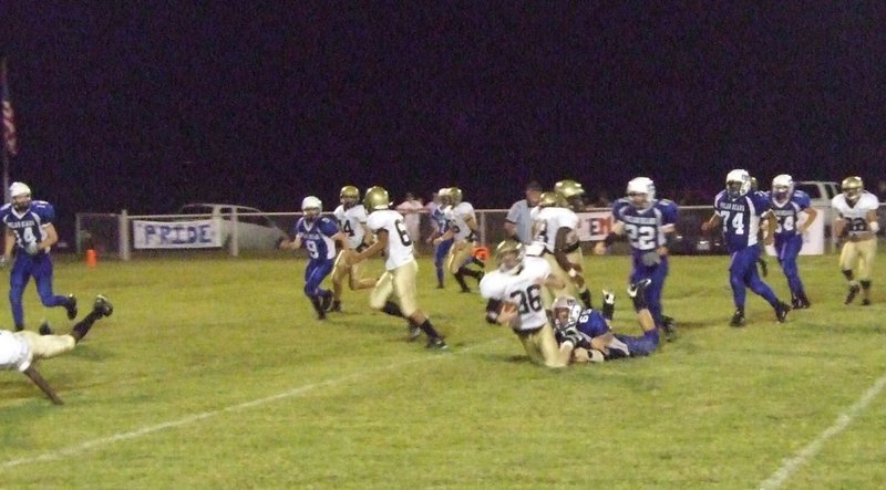 Image: Justin Hayes — #36-Justin Hayes (Huck) gets tackeled.