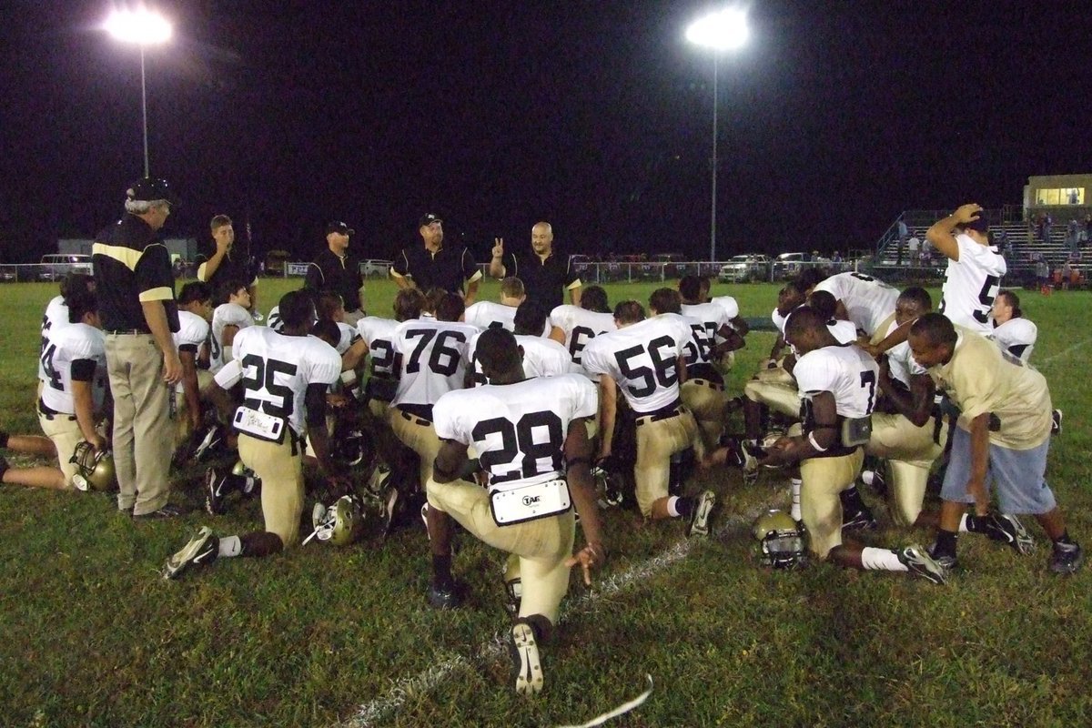 Image: The huddle — The Gladiators get a word of encouragement by the coaching staff.