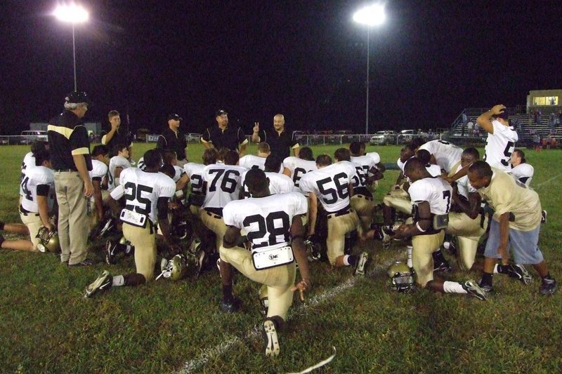 Image: The huddle — The Gladiators get a word of encouragement by the coaching staff.