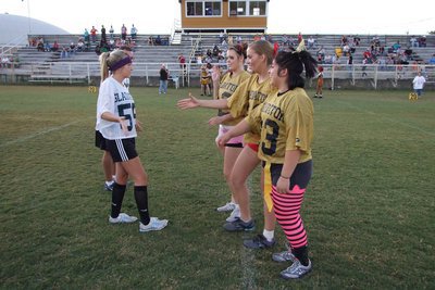 Image: A Handshake To Begin — Lexi Miller shakes hands with Stephanie Carter, Becca DeMoss and Blanca Figueroa before the clash begins.