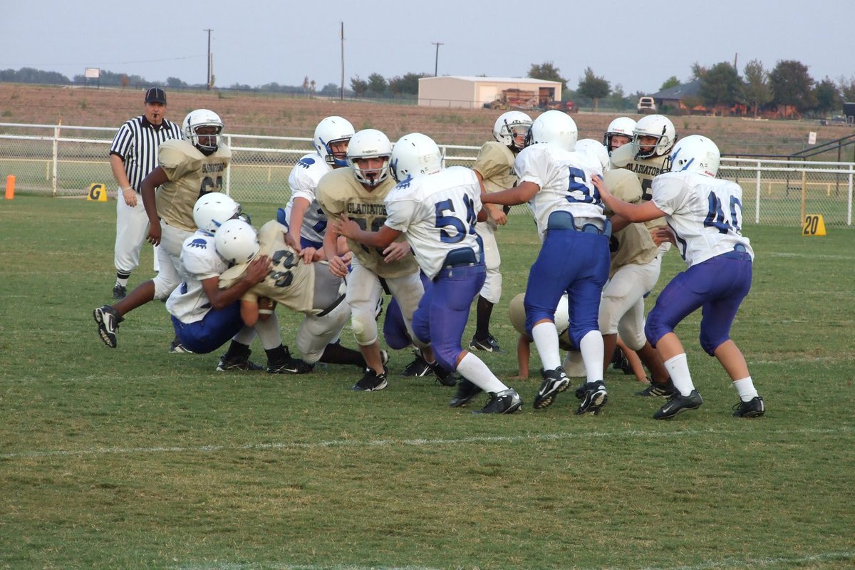 Image: Into the fray - #32 Reed Jacinto carries the ball.