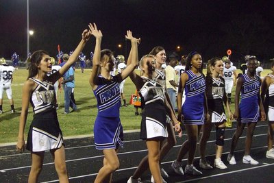 Image: Introducing … — IHS cheerleaders introduce the Chilton cheerleaders.