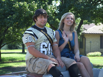Image: Ivan and Meagan — Ivan Roldan and Meagan Hopkins wave hello.