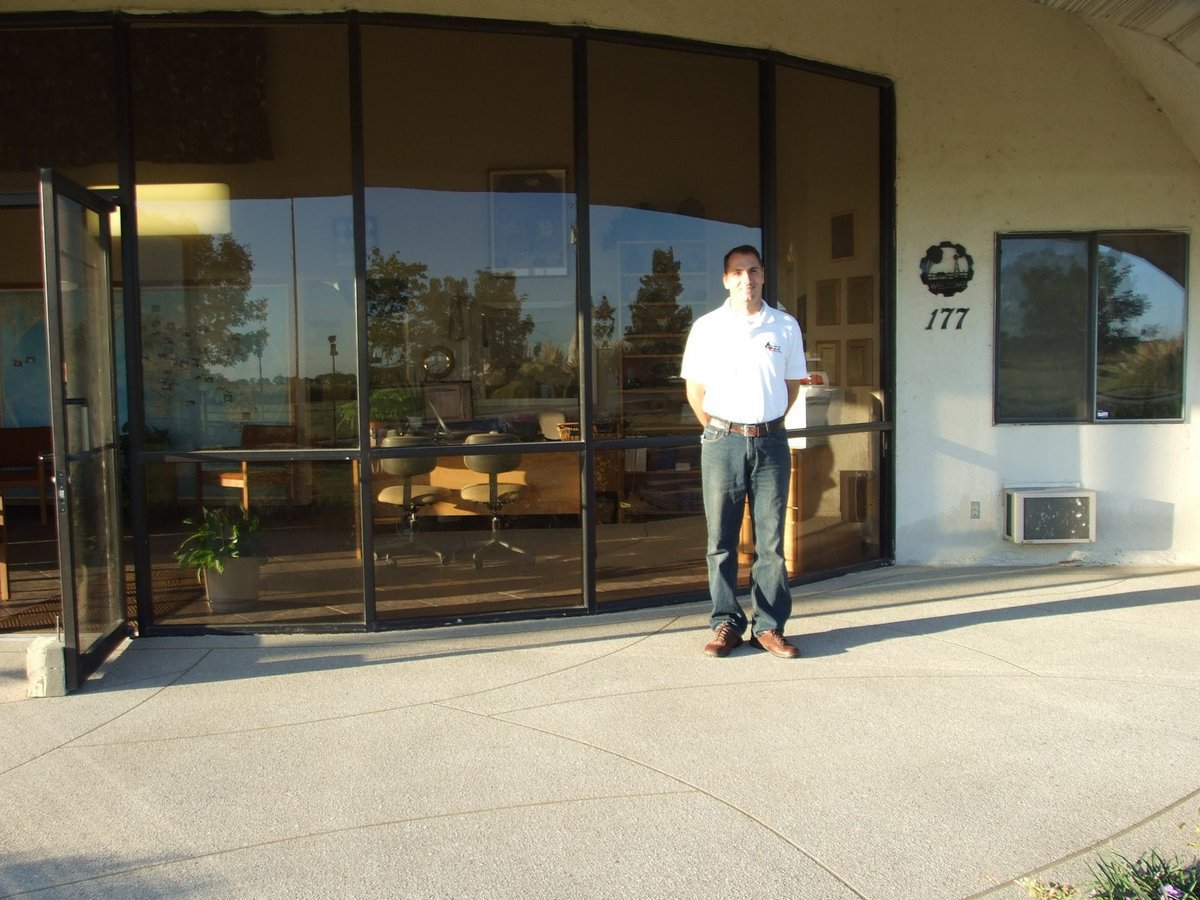 Image: Todd Graham — Todd Graham standing on the beautiful decorative concrete porch he recently did for Monolithic Constructors. Lots of hard work went into this but as you can see it is worth it.