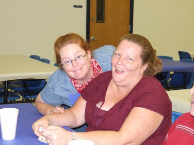 Image: Having fun — Kristy Strange and Stephanie Clingenpeel having fun at the lasagna dinner.