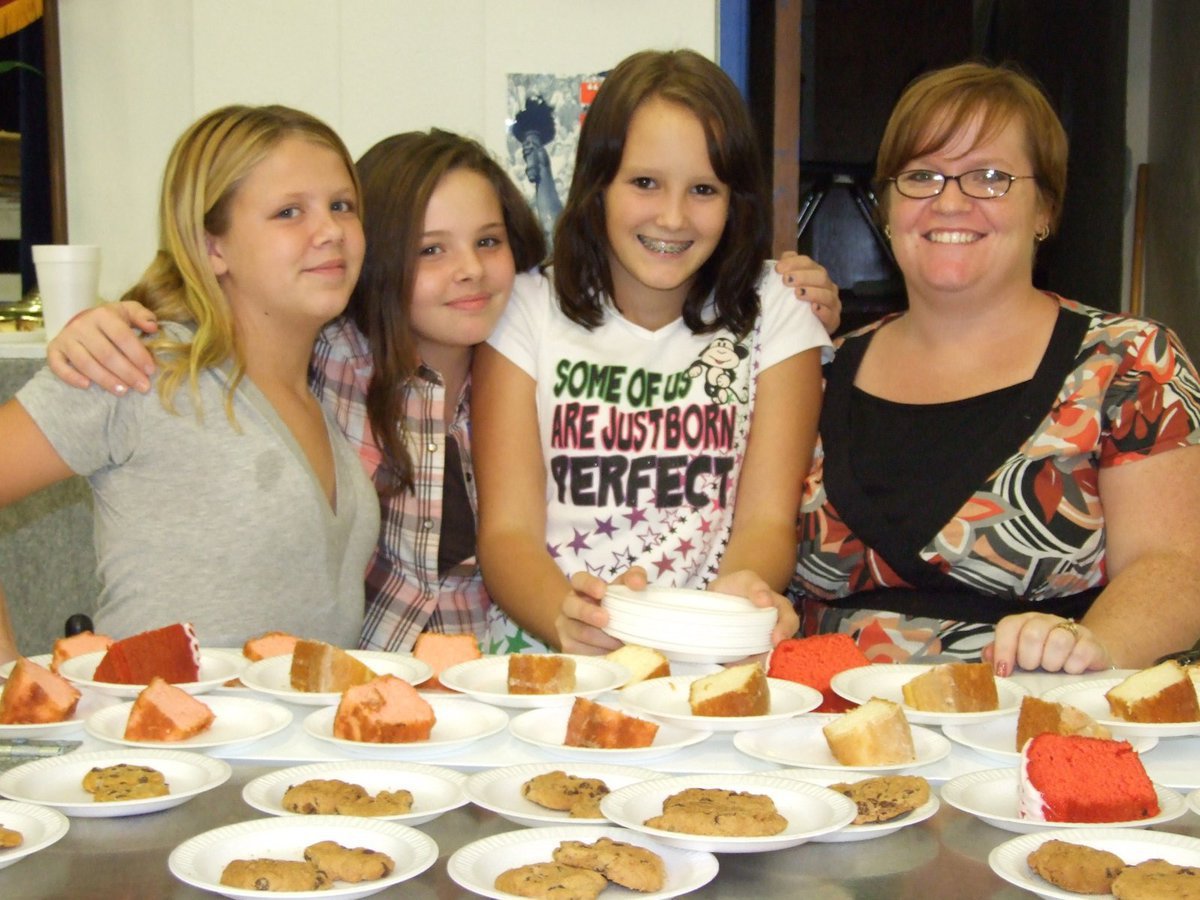 Image: Lots of deserts — Alyssa Sprabary, Brittany Scamahorn, Stormy Bennett and Tonya Krnavek, Junior High cheerleaders and their sponsor — Tonya Krnavek.